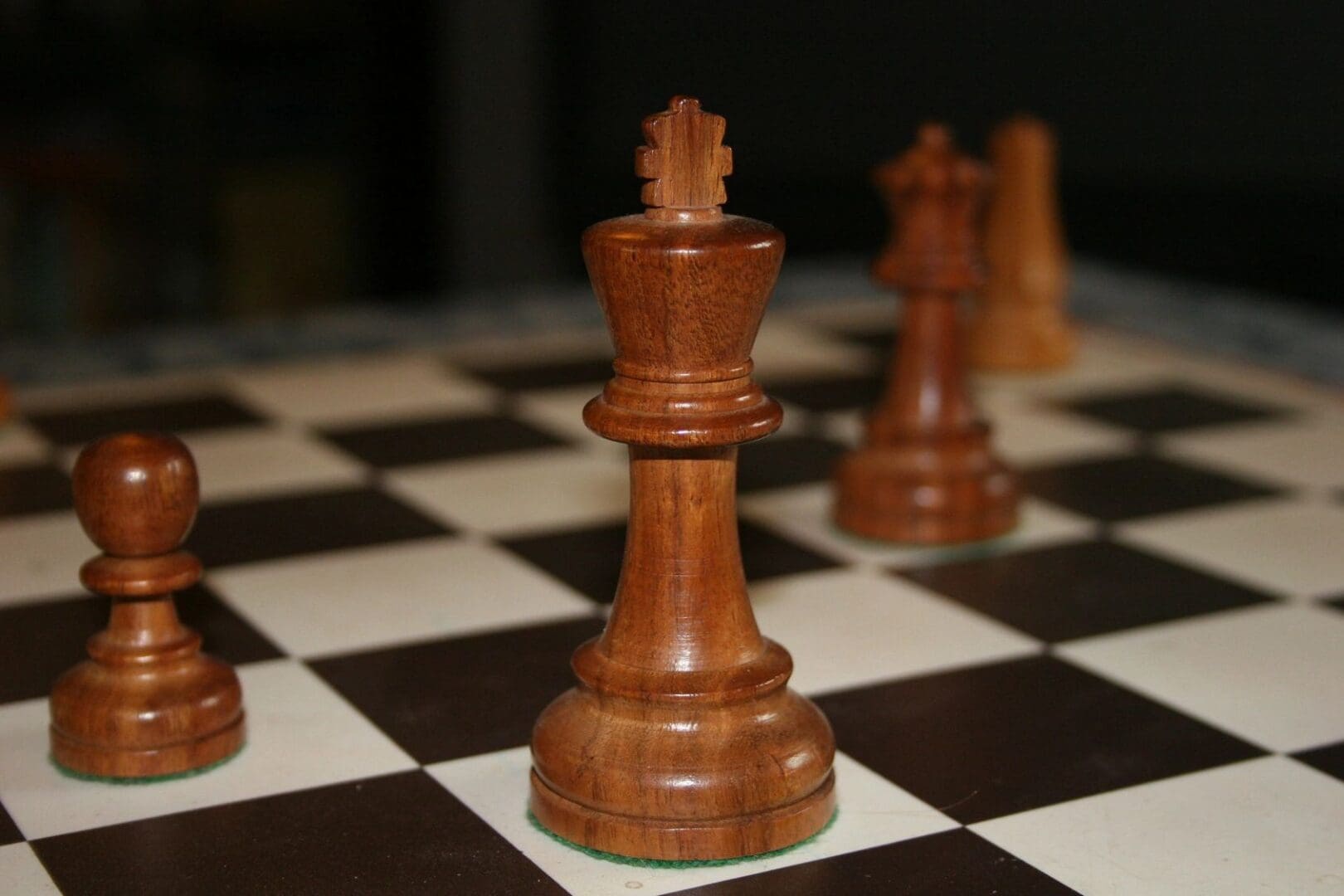 A close up of some chess pieces on the board