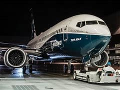 A large airplane is parked on the tarmac.