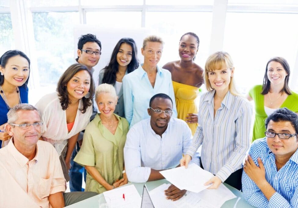 A group of people standing around each other.