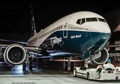 A large airplane is parked on the tarmac.